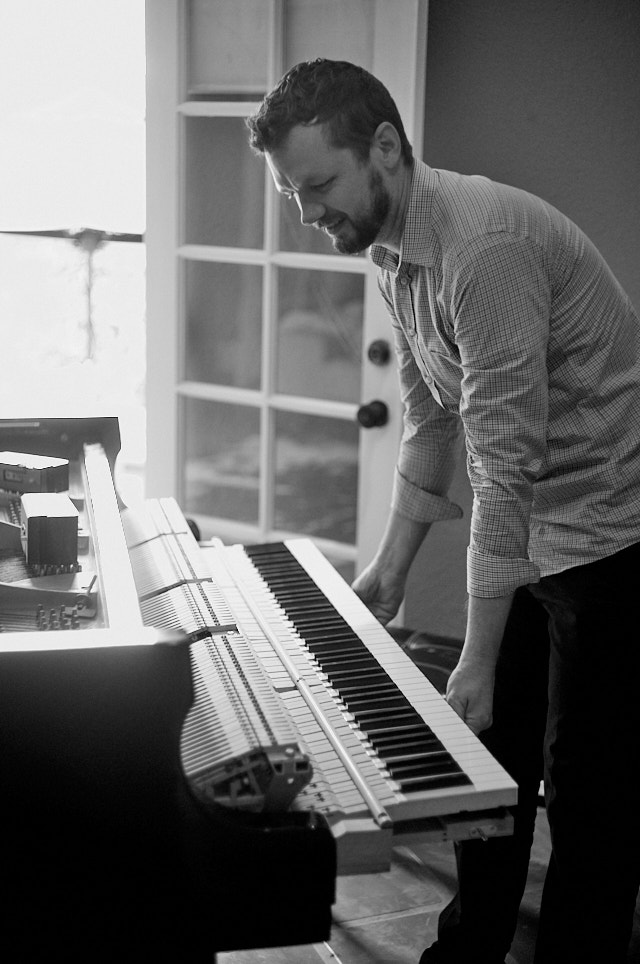 The piano tuner came by to tune my piano. Leica M11 with Leica 50mm Summicron f/2.0 II Rigid. © Thorsten Overgaard.