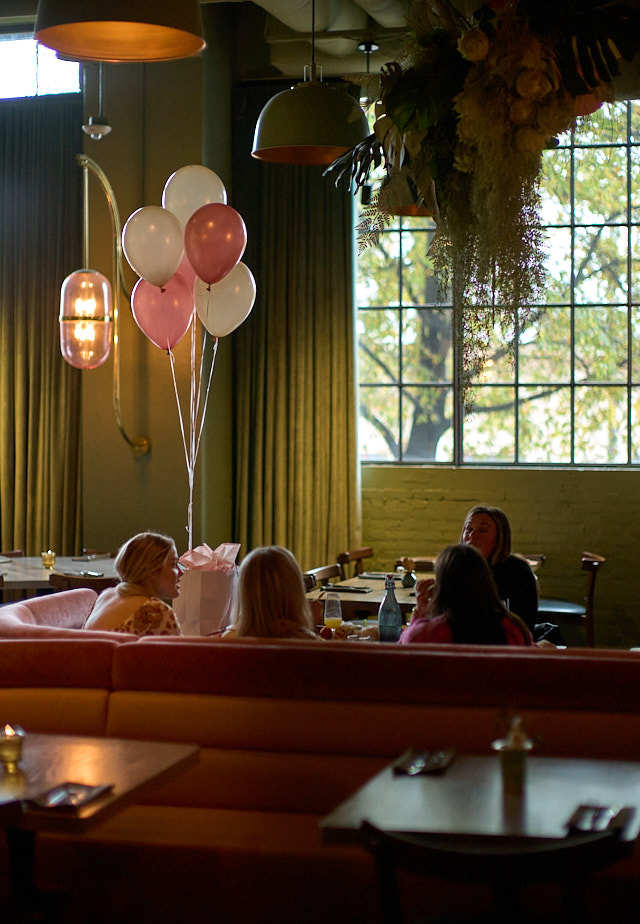 Birthday party in Atlanta. During lunch in a nice restaurant we observed these girls celebrating birthday, and then doing photos with cameras and iphones after. Leica M11 with Leica 50mm Noctilux-M ASPH f/0.95. © Thorsten Overgaard.