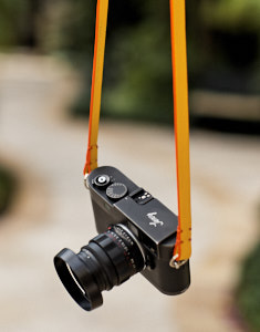 125cm x 15mm x 3mm Black Calfskin Camera Strap with orange edges. Inscription on the inside, "Always Wear A Camera".