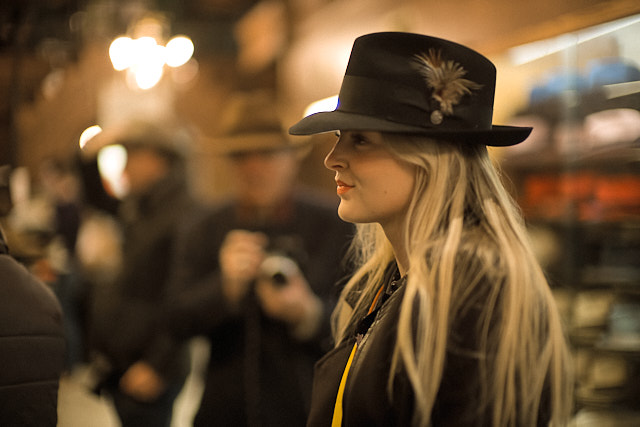 My oldest daughter Caroline in the JJ Hat Store in New York (with a group of workshop students in the background). Leica M10-P with Leica 50mm Noctilux-M f/0.95 FLE. © Thorsten Overgaard. 