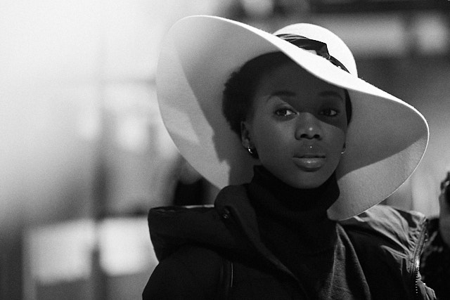 Flare overflow from a spotlight picked up at the corner. Model Pesy Therese in Gucci hat. Leica M10-P with Leica 90mm Summilux-M ASPH f/1.5. © Thorsten Overgaard. 