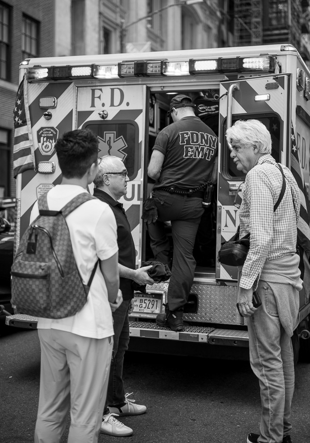 Dennis, Steven and Carlos by the ambulance, ready to go to the hospital. Leica M10-R with Leica 50mm APO-Summicron-M f/2.0 LHSA. © Thorsten Overgaard.