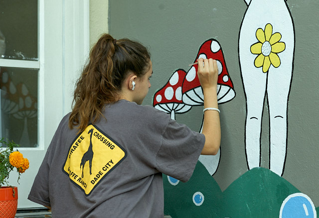 Young artist at work. Commissioned a murial by 15 year old artist Mia Bego.
