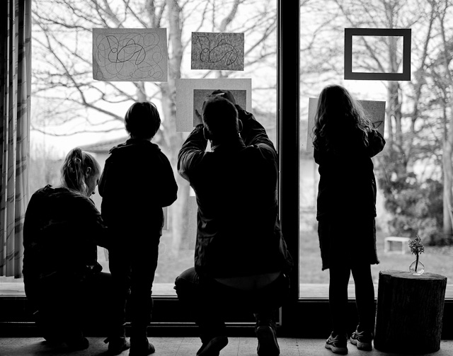 Parents and kids making an exhibition of the freshly made drawings and paintings. Leica M 240 with Leica 50mm APO-Summicron-M ASPH f/2.0