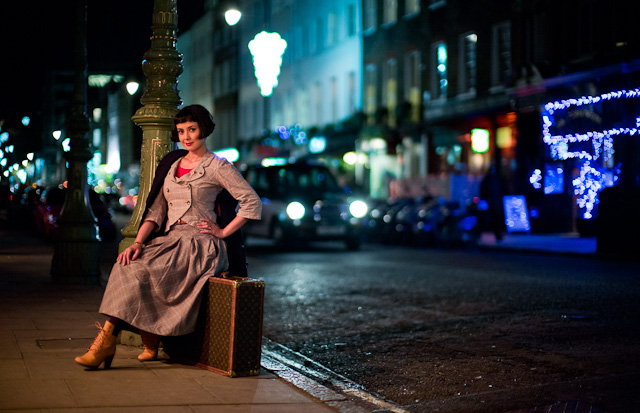 British actress Rebecca Grant photographed in Charlotte Street, London. The main light source is a 2000 kelvin "gas lamp" above mixed with red heaters on a wall to the left. The front light on the taxi and the main lights behind her is 3400 Kelvin. In this case I adjust the image to 2000 Kelvin because that is her face, but then I increased it to 2200 Kelvin to warm up the colors in her face a little. Leica M 240 with Leica 50mm Noctilux-M ASPH f/0.95.© 2014-2015 Thorsten Overgaard. 