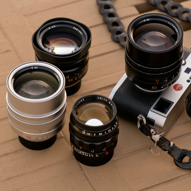 The Noctilux 'King of the Night' lens. From left the 0.95 in silver (same on the camera, in black, the f/1.0 in the back and the rare and expensive first model, the f/1.2 in the front. 