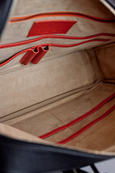 Eight pockets (four on each side) for passports, business cards, notebooks. The pockets are flat and don't take up any space when not in use, but allow for rather bulky things in them, when used. They don't take up any space but give you lots of space for organizing and storage.