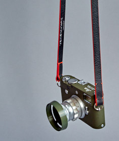 125cm x 15mm x 3mm Black Calfskin Camera Strap with orange edges. Inscription on the inside, "Always Wear A Camera".