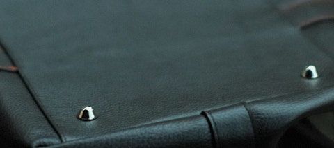 Metal studs in the bottom so you can park the bag.