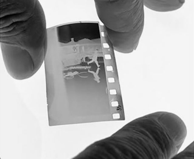 The original negative from “Behind St. Lazare”. I tested with 35mm and 50mm, and my conclusion is that he must have used a 50mm because of the blur of the tower in the background. Any 35mm lens would result in a sharper background than is the case. Photo by John Leongard.