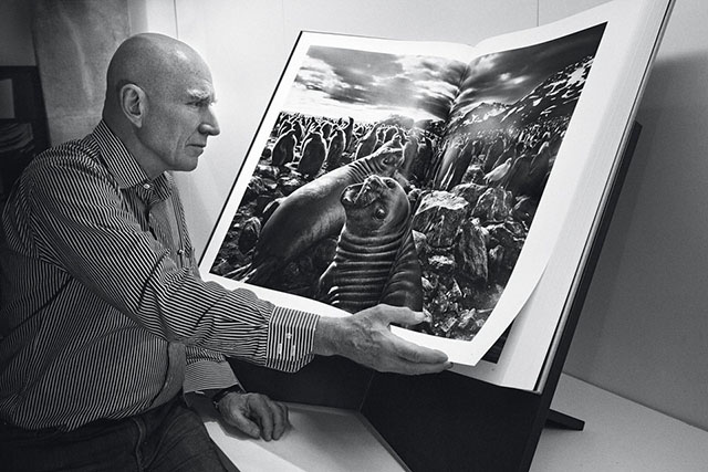 Sebastião Salgado with his book "Genesis". Salgado have been using Leica for many years, but also other cameras. When using Leica film cameras, he has been known to use three cameras at the same time, each with different lens. 