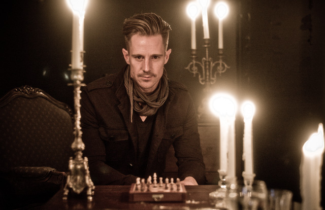 Actor Jason Dohring caught in a dark room lit by only candle lights. TIFFEN Pro Mist 1 filter on Leica 50mm Summilux-M ASPH f/1.4. © Thorsten Overgaard. 