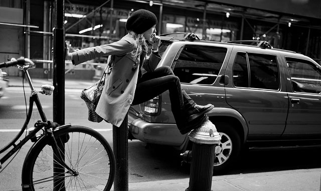 Girl on the phone in the Fashion District, New York. The bag is a 3,000$ "Ambassade" document bag from Goyard in Paris, stuffed with a water bottle, newspaper and what else a woman needs on the road. Now I must have one...