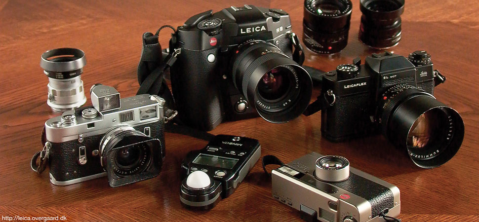 Some of the Leica cameras: Leica M4 with 21 mm Super-Anuglon-M f/3.4 and 50mm Summicron-M f/2.0 behind it. A Minolta Flashmeter IV (used for measuring light manually). Leica R8 with motor drive and 35-70mm Vario-Elmar-R f/4.0 and the Leicaflex SLmot with 80mm Summilux-R f/1.4 (and the 35mm Elmarit-R f/2.8 and 90mm Summicron-R f/2.0 behind them). Finally the Leica Minilux with buit in silent winder and 40mm Summicron f/2.8 autofocus lens.