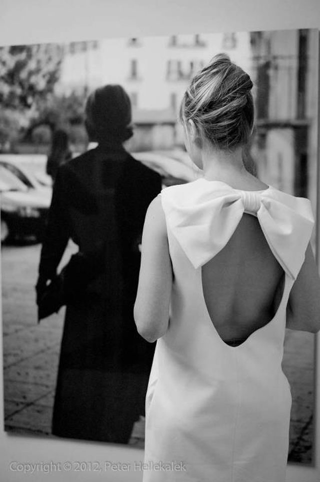 Singer-songwriter Catherine Kubillus posting for professor Peter Hellekalek in front of 'The Dior Lady' large limited print at the Leica Galerie Salzburg.