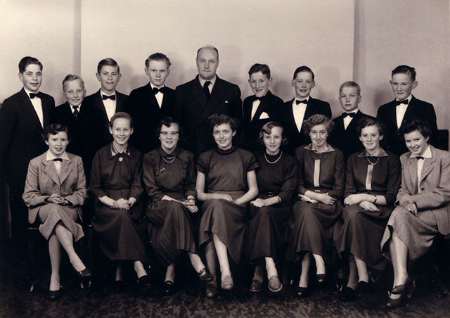 My aunt Connie (far left) and my mother Jytte (far right) in 1954 with their class and the priest, preparing for their confirmation. 