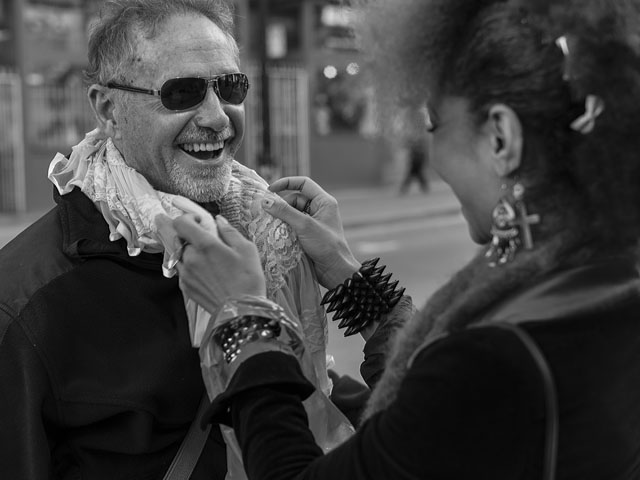Playing around with acessories and styles. Larry Wiedel gets a new look by the help of model Joy. Photo by Douglas Ball.
