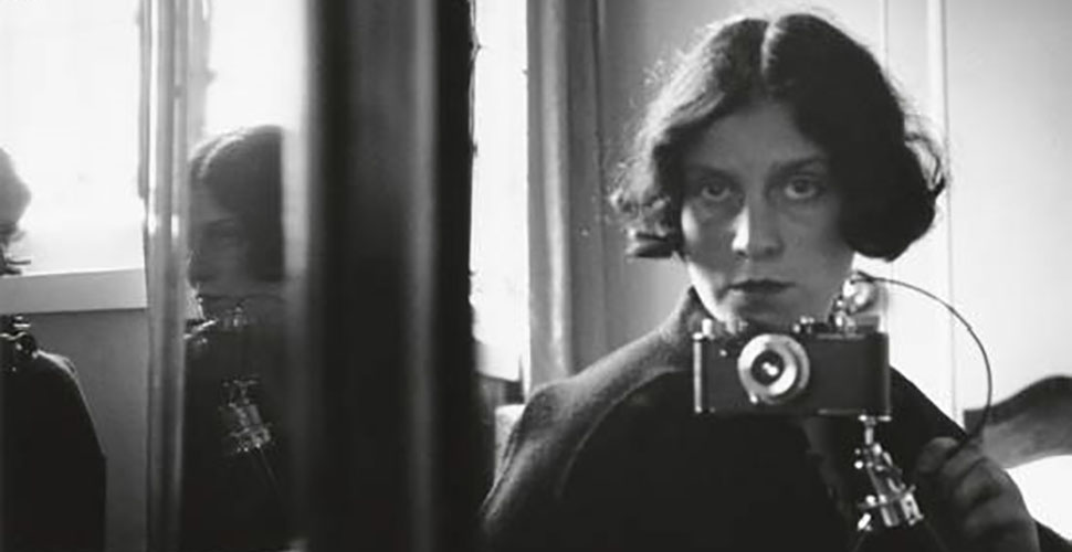 Ilsa Bing in one of her settings for self portrait in mirror, 1931. 