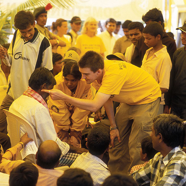 Mr. Scandrett (United Kingdom) from the Scientology Volunteer Tsunami Relief Team deliver a Scientology "Touch Assist" to an indian man at the Suttor Religious Festival in India. Leica R8 with Leica 80mm Summilux-R f/1.4. © Thorsten Overgaard.