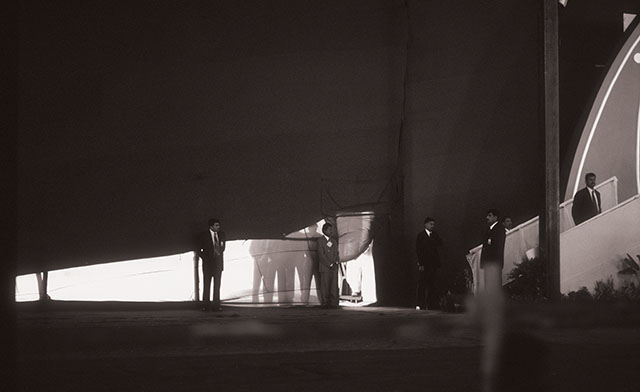 I was there too: The Indian Prime Minister is speaking at the Suttur Religious Festival while his bodyguards watch the exit to the helicopter outside the tent. © Thorsten Overgaard. 