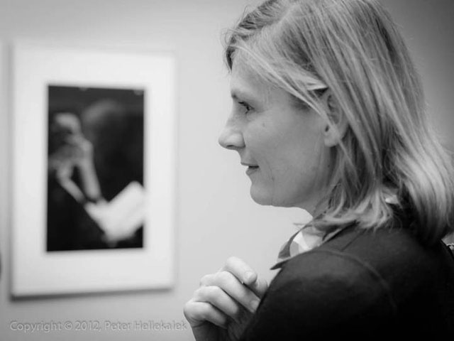 Guest looking at the photographs. Photo by professor Peter Hellekalek. 