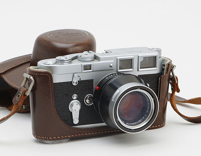 leica m3 921255 and 50mm summicron rigid black 1582118 The camera is worth somewhat $1,700 on eBay, the lens shade about $250, and the lens - because it is black and not silver - is worth a lot. leica-m3-921255-summicron-1582118
