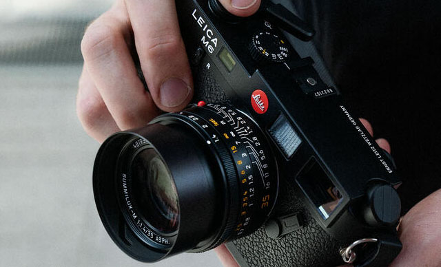 The Leica M6 (Model 10557 in 2022) has engraving on the top plate, "Ernst Leitz Wetzlar Germany" and serial number engraved on the hotshoe.