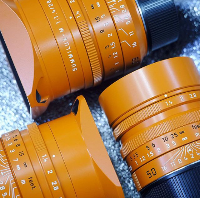 Orange painted 50mm, 35mm and 28mm Summilux lenses from Kantocamera 
