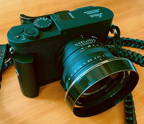 Leica Q-P with the black painted brass ventilated shade, well used. Photo by Frank Wittmer