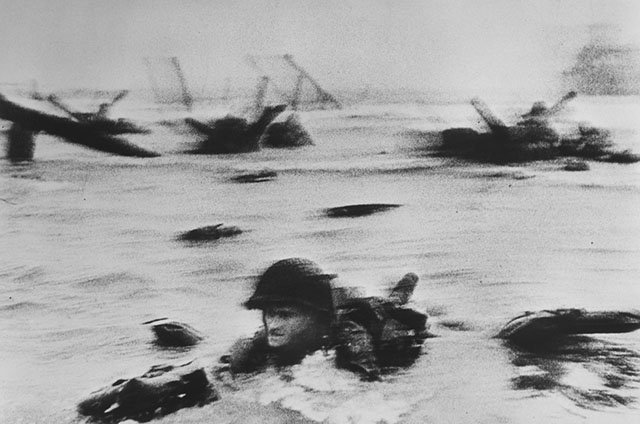 Robert Capa's "American troops landing on Omaha Beach, D-Day." from 1944.